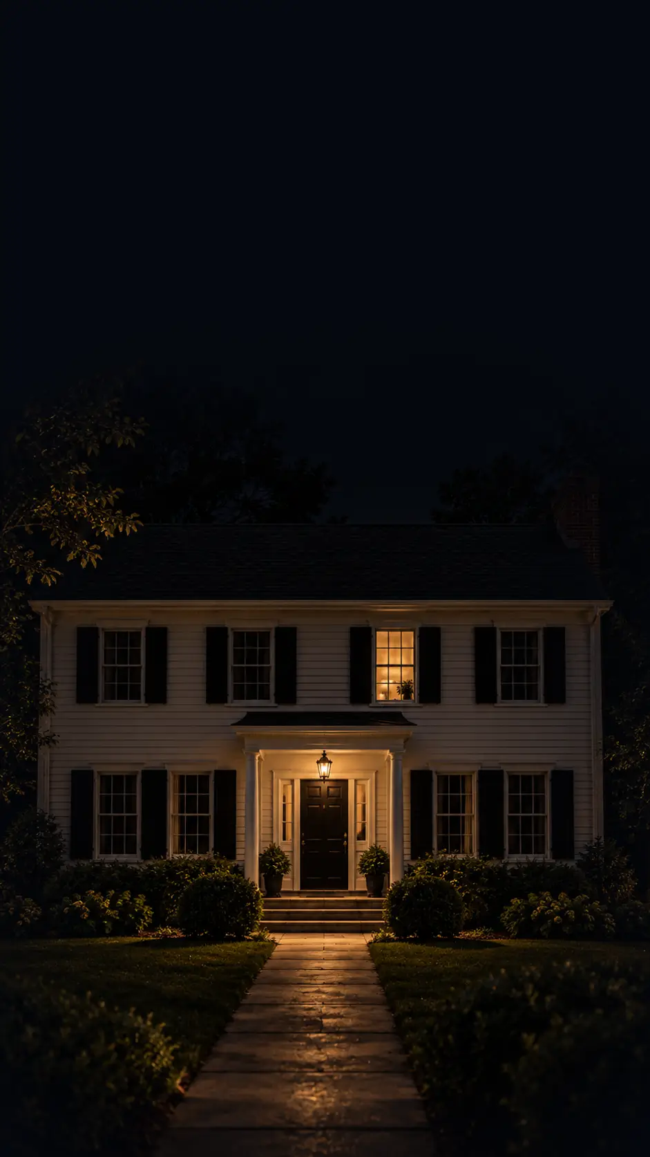742 Maple at night, one upstairs window lit